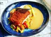 DOS DE CABILLAUD EN CRÔUTE DE CHORIZO, WOK DE LEGUMES, RIZ ET BISQUE DE CRUSTACES